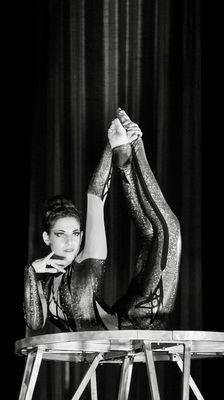 (Pictured) Coach Ariana. Come join our contortion and flexibility classes. Offered online and in person.