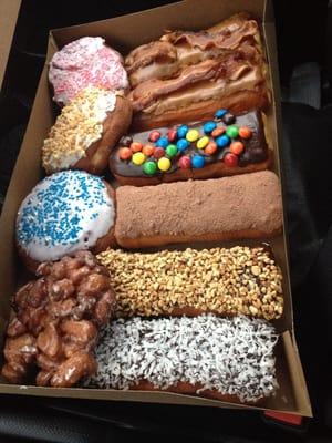 Amazing selection of doughnuts! Maple bar with bacon... Mmm