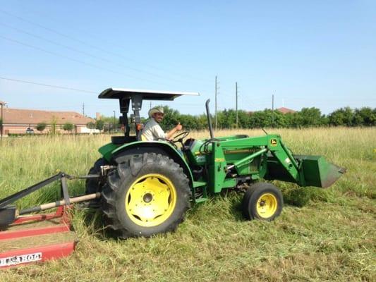 Mowing down a big field that needed maintenance