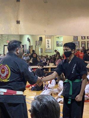 My son passing his belt test for Senior green