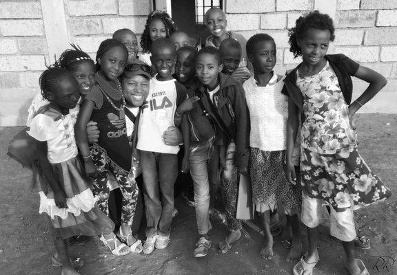 Beatrice (front center) is a determined little soul. She walks 7 miles to church through the African brush because she won't miss service.