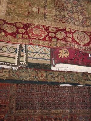 Oriental rugs and tapestries drying