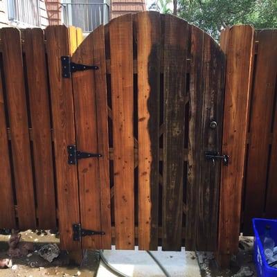 Wood fence left side clean right side dirty.