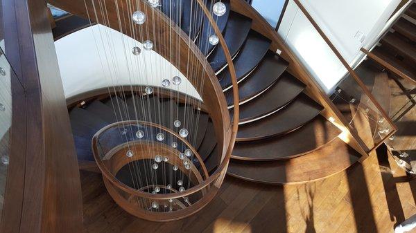 Walnut circular free standing stair.