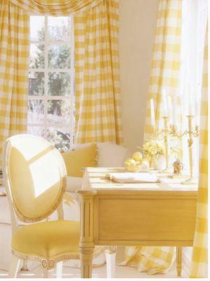 Beautiful desk painted yellow with French style chair and plaid curtains.