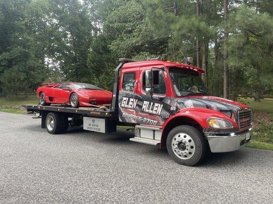 Tow truck carrying an exotic sports car