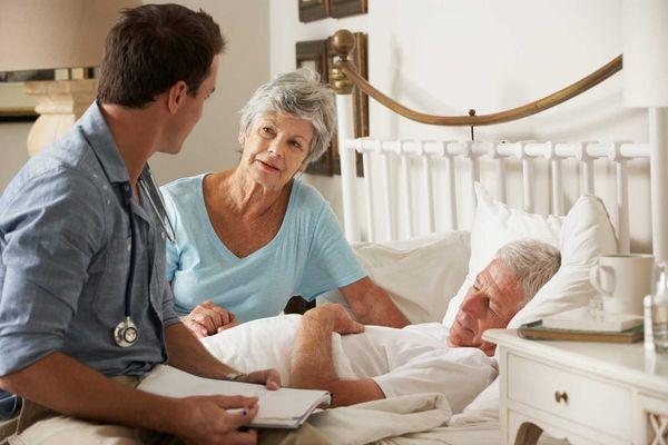 Home Health Aide Providing home care services and Hospice Care to a senior in bed