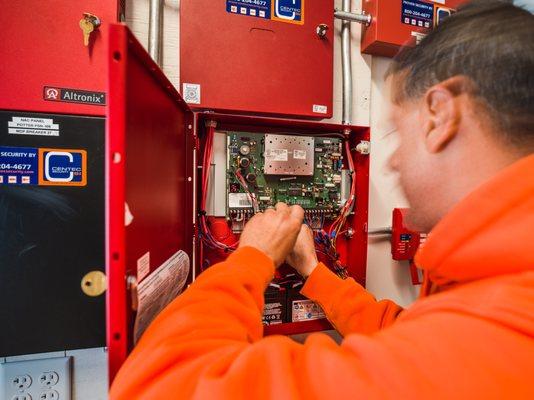 Centec Technician working on wiring.