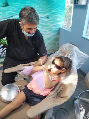 Dr. D's patient Andrea is showing him where she cleans her teeth and shared with him how important it is not to forget the ones in the back!