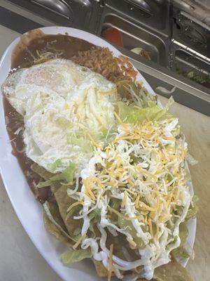 Chilaquiles Verdes with eggs sunny side.