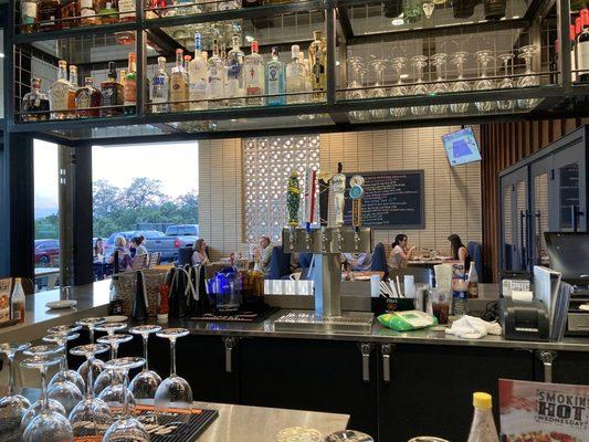 Bar with open window to patio