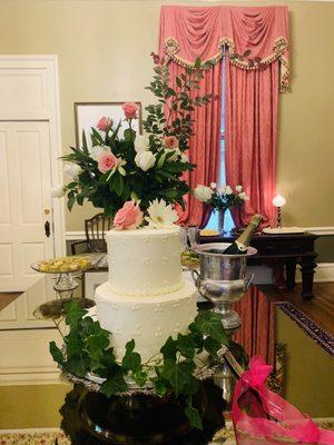 Beautiful wedding cake and champagne in reception area