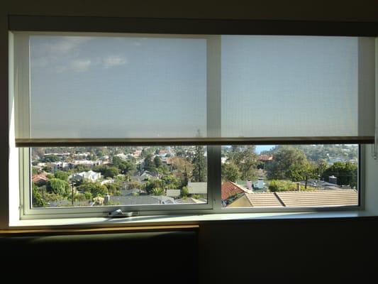 Kitchen window shades; somewhat see-through so you can still see the view but block the sun and UV rays