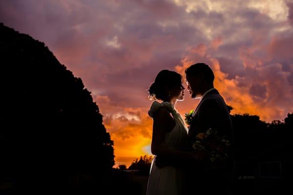 a kiss against a beautiful sunset