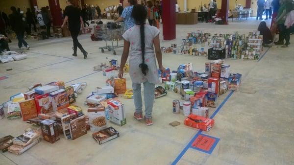 My volunteer buddy sorting the food.