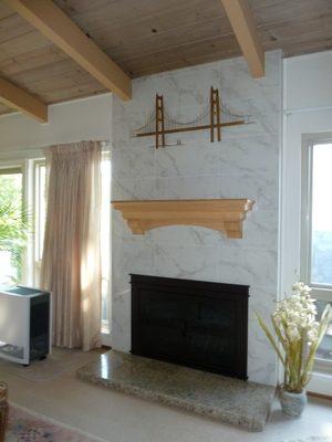 After - New tile & fire place! Bravo!!!