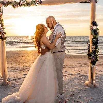 Blush and navy decorated bamboo wedding arch in Indian Rocks Beach