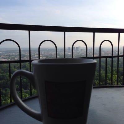 Hot morning tea as the sun rises over downtown. View from the balcony facing northeast.