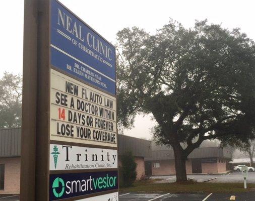 Our sign on Creighton Road, just across from WalMart. Our office is the back building with better parking.