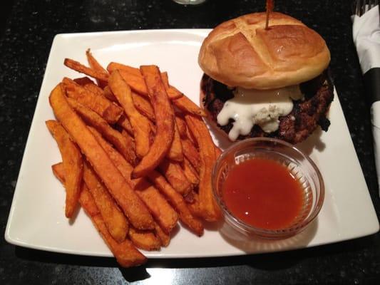 Yummy burger: blue cheese with buffalo sauce on the side with delicious sweet potato fries.