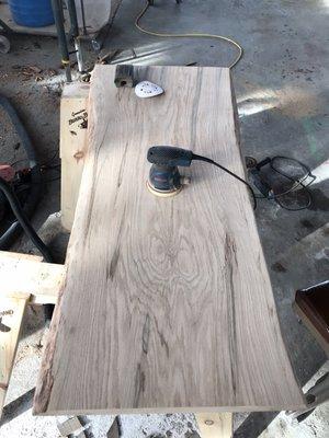 Sanding a custom bar top. Pin oak