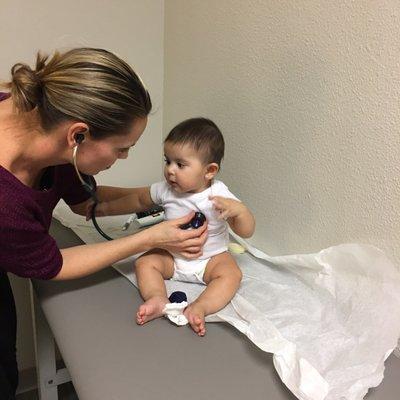 Our little girl investigating the toy her favorite doctor always uses.