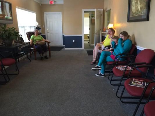 Well-lit waiting room offers panoramic vistas over the easterly parking lot...