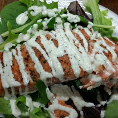 Smoked salmon with a cilantro lime mayo with spring salad mix.