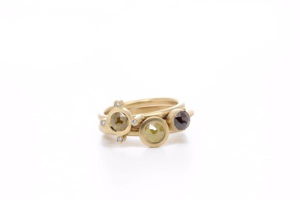 Stack of 18k yellow gold rings with natural colored rose cut diamonds!