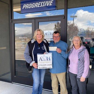 George and Cindy presenting a donation to the Civilian Mounted Possee.