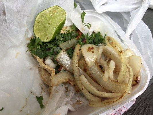 Al Pastor taco, with grilled onions on the side