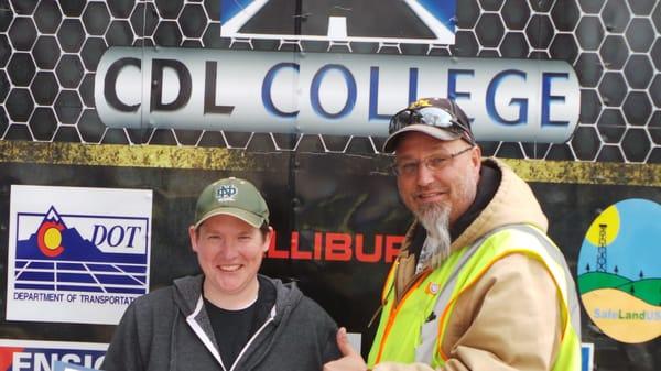 Mike White with CDL College congratulates a graduating student.