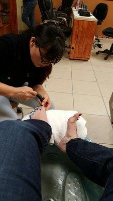 Getting my toes done.