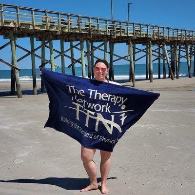 Katelyn showing her TTN pride at the beach!