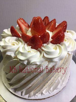 Small tres leches cake with fresh strawberries