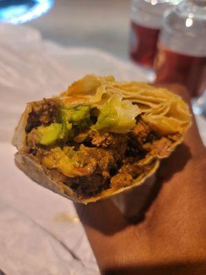 Inside the Carne asada burrito is avocado and cheese