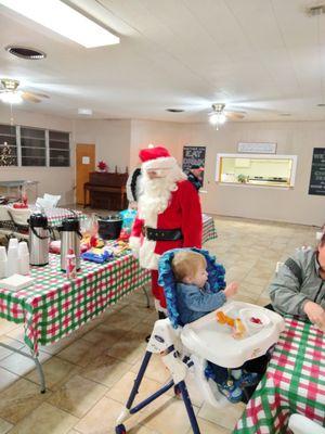 Christmas Caroling in neighborhood along with Santa, hot chocolate and cookies