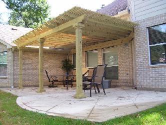 This backyard wood patio cover in Keller TX was built by Circle D Industries. This photograph was provided by Dallas Deaver o...