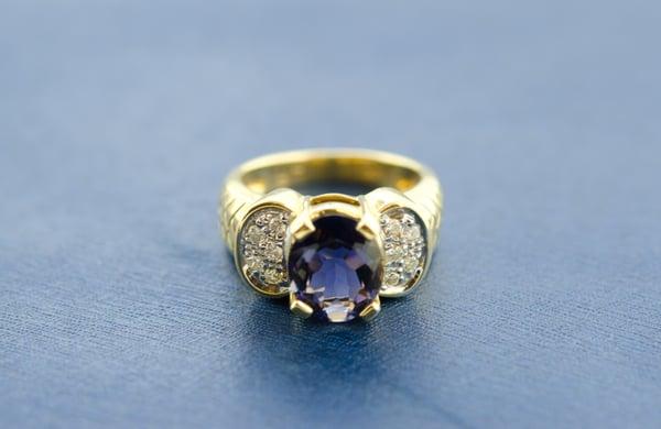 Yellow Gold Pave round diamonds with center Oval iolite