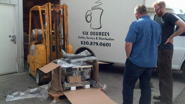 A brand new espresso machine fresh out of the box ready to be delivered and ready to make some delicious espresso!