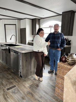 The pics are of my husband with Maria, standing in the kitchen of our new home.