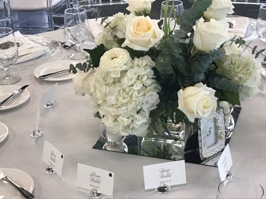 All white wedding centerpieces low on table