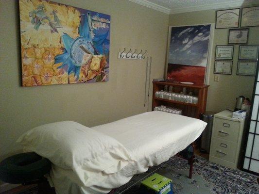 My acupuncture office complete with compounding Chinese Herbal pharmacy for individualized formulas.  A heated massage table and paintings.