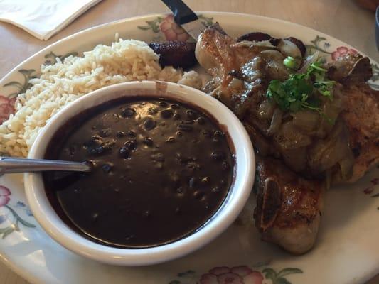 Two thick pork chops with beans, rice and plantains from the specialty menu. 11.99. Enough for 2 people.