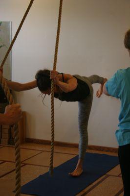 An instructor demonstrating Third Salute to Mother Earth