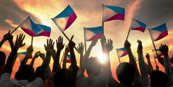 A group of Filipinos waving the Philippine flag symbolizes unity and connectedness.  This is the mission of ©FIP.