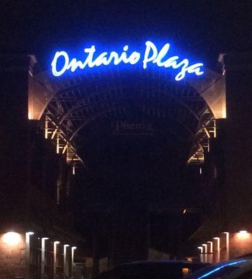 Ontario Plaza shopping center at night.