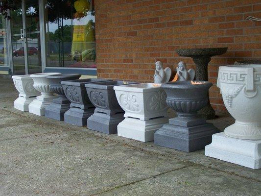 We carry a great line of cement cemetery urns .