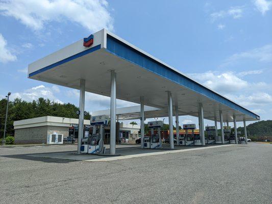 Outside. Gas station. 12 pumps.