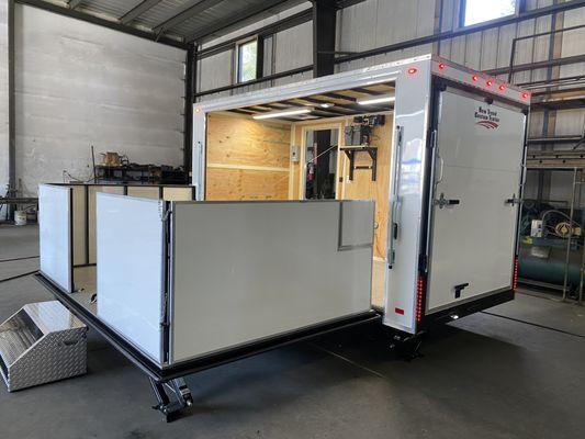 Stage trailer with hand railing that offers plenty of signage opportunities to promote your brand and business.